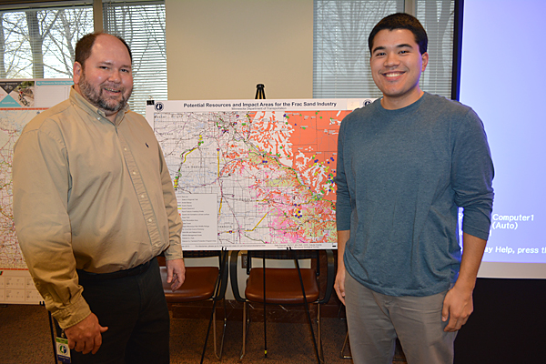 Photo of Dan Flatgard and David Tomporowski in front of Tomporowski’s winning GIS poster